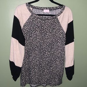 Women’s long sleeve leopard pattern top with tan/black color block sleeves